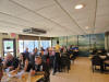 May be an image of 9 people, table and text