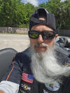 May be an image of 1 person, beard and motorcycle