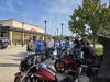 May be an image of 7 people, motorcycle, scooter and text